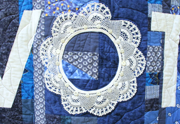 Detail of a TextileFusion doily quilt about registering to vote, by Suzann Thompson